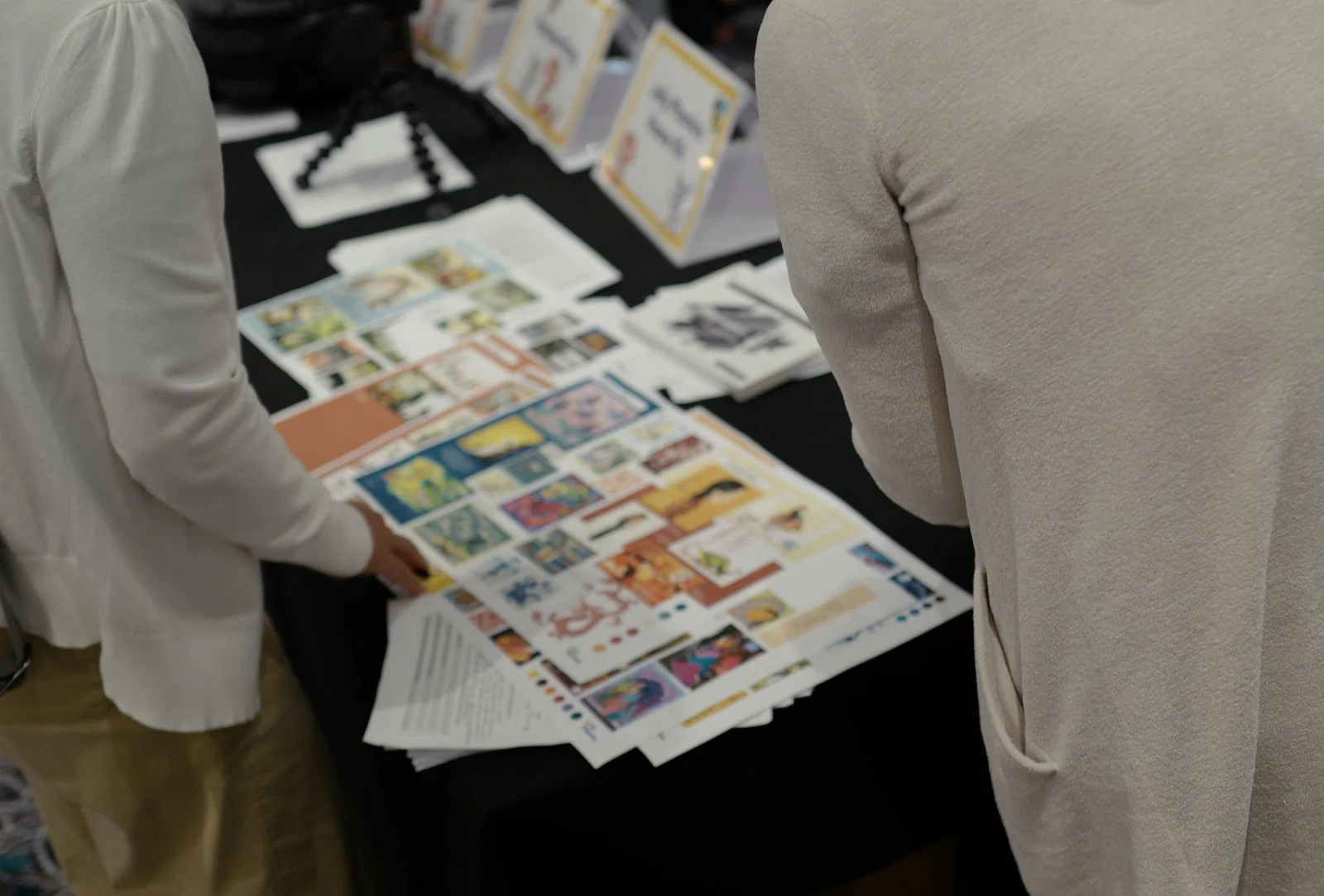 English teaching materials being examined by participants at a trainers’ conference